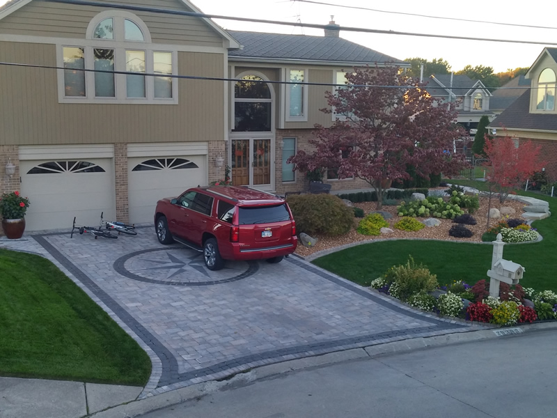brick-paver-driveway-stone-retaining-wall-plantings