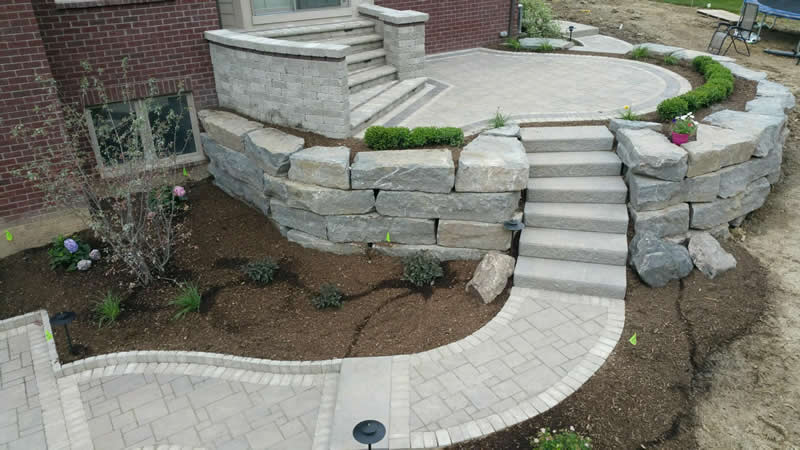 outdoor-living-space-stone-retaining-wall-paver-fireplace-patio-2