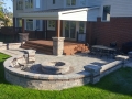 outdoor-living-space-firepit-brick-paver-patio-wood-deck-retaining-wall