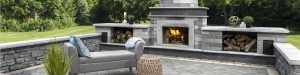 Outdoor Living Space with Brick Paver Fireplace and Retaining Wall