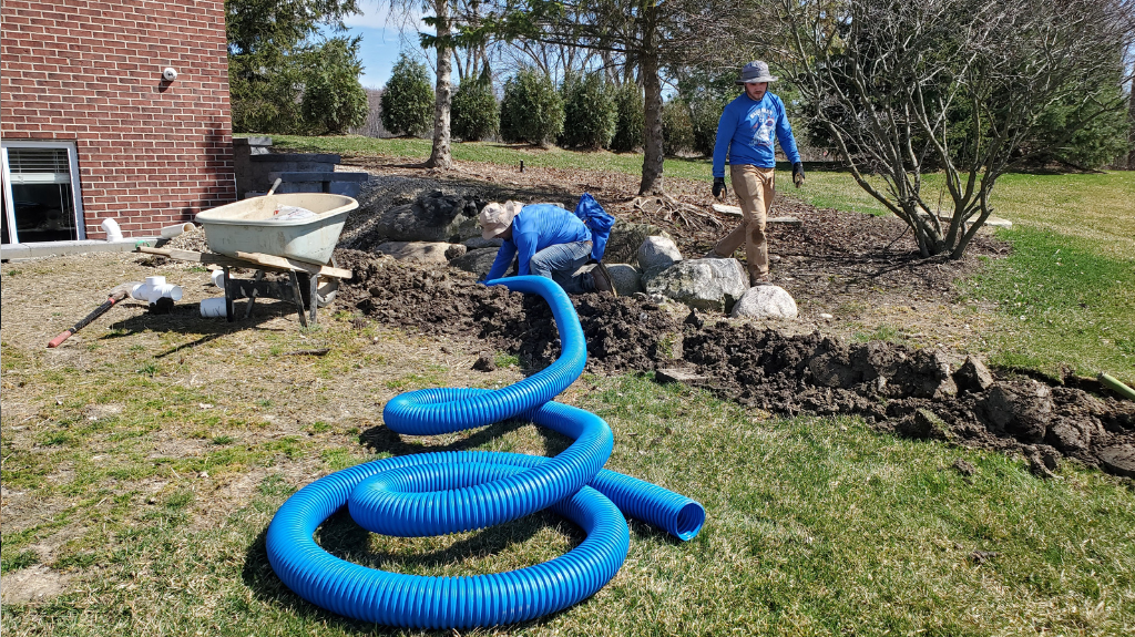Buried Downspout Installation Michigan